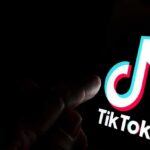 TikTok logo on a smartphone screen