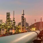 Energy Coup Or Mirage? Trump Teases Control Oil refinery with pipelines at sunset