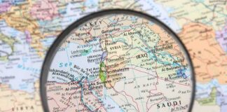 Magnifying glass over Middle East map