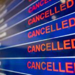 UK Skies Freeze – System Crash Chokes Departures airport departures board showing multiple cancelled flights