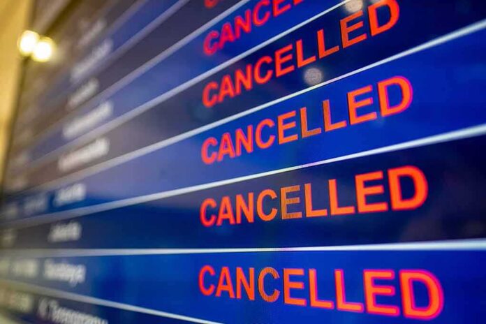 shutterstock_1683404359 airport departures board showing multiple cancelled flights