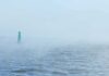 Nazi Submarine Leaks Mercury – 80 Years Later Green buoy in foggy sea