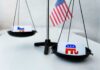 Free-Speech Ruling Supercharges Republicans Scales with political party symbols and a small American flag