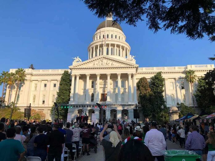 Crowd gathers before a neoclassical capitol building with dome