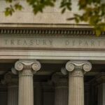 Treasury Surge: Who Gets Crushed First? Neoclassical building facade with Ionic columns and engraved frieze