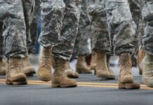 Staggering Base Damage – Photos Finally Surface soldiers' boots marching on a road