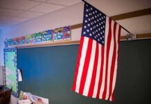 Vodka Run Exposed – Bathroom Meltdown Shocks Elementary American flag hanging in a classroom