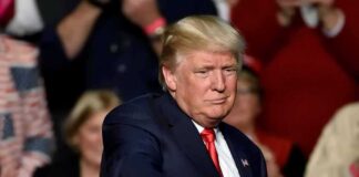 Donald Trump points toward the audience at an event