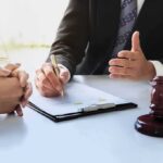 White House Ad Triggers Copyright Showdown Lawyer and client discussing documents at a desk