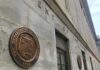 Foreign ID Loophole Bleeds Millions U.S. Treasury building exterior with bronze seal on stone wall
