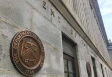 Foreign ID Loophole Bleeds Millions U.S. Treasury building exterior with bronze seal on stone wall
