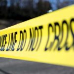 Philly Ambush Leaves Hero Officer Down Yellow police tape stretched across an outdoor scene
