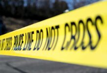 Philly Ambush Leaves Hero Officer Down Yellow police tape stretched across an outdoor scene