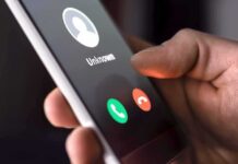 Campaign Calls Mapped – Chills Free Speech? Hand holding smartphone with incoming unknown call screen