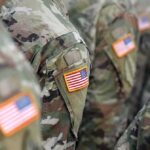 DHS Line Shocks Bases – Spouses Still Snagged U.S. flag patches on camouflage military uniforms