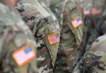 DHS Line Shocks Bases – Spouses Still Snagged U.S. flag patches on camouflage military uniforms
