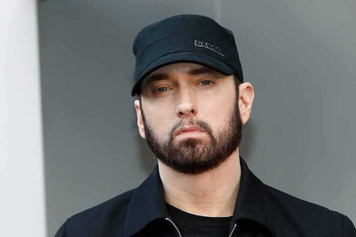 shutterstock_1632717139 Eminem in a black cap and jacket