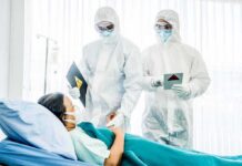 Court-Ordered Ivermectin: Survival Rate Stuns Gatekeepers Medical staff in hazmat suits attend to a patient in a hospital bed