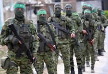 Overseas Targets: Hamas Leaders On Notice Armed men in camouflage uniforms standing in a line