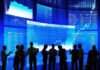 Bond Panic: France Triggers Euro Jitters Silhouetted business professionals in front of digital stock market displays