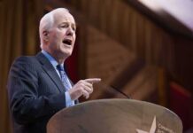 Donor Room Gasps: GOP Heavyweight Freezes Out Paxton John Cornyn speaking at a podium