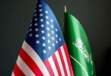 Embassy Pullout Ordered Amid Houthi Threat United States and Saudi Arabia flags side by side