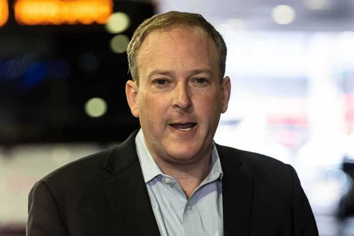 Man in a suit speaking indoors