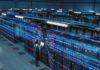 Scary Preview: Microsoft Seals Off Data Technician with laptop in a large data center aisle