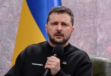man holding a microphone during a talk