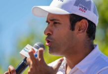 Estranged Mom – Brutal Ohio Ad Sparks Bipartisan Outrage Man in white cap speaking into a microphone outdoors
