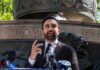 City Cash Doubles – Artist Handouts Jump Zohran Mamdani speaking at an outdoor press conference