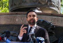 City Cash Doubles – Artist Handouts Jump Zohran Mamdani speaking at an outdoor press conference