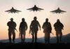 Awarded For What? Heroism Hidden – Air Force Clams Up Soldiers walking with fighter jets flying overhead at sunset