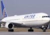 United Airlines jet taxiing on runway