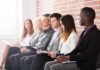 Red Flags Behind That ‘Low’ Unemployment Job applicants seated in a row with clipboards